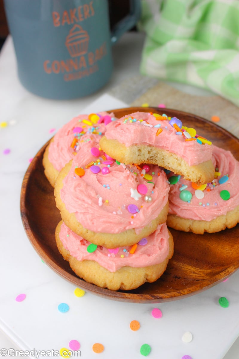 Easy Sugar Cookies that bake soft, moist dense and thick, topped with vanilla frosting.
