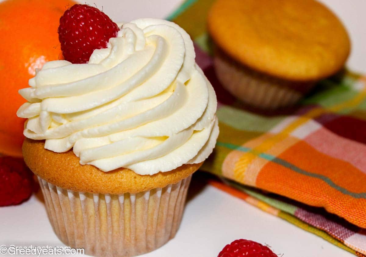 Soft and Moist Orange Cupcakes topped with silky Orange Buttercream Frosting. 