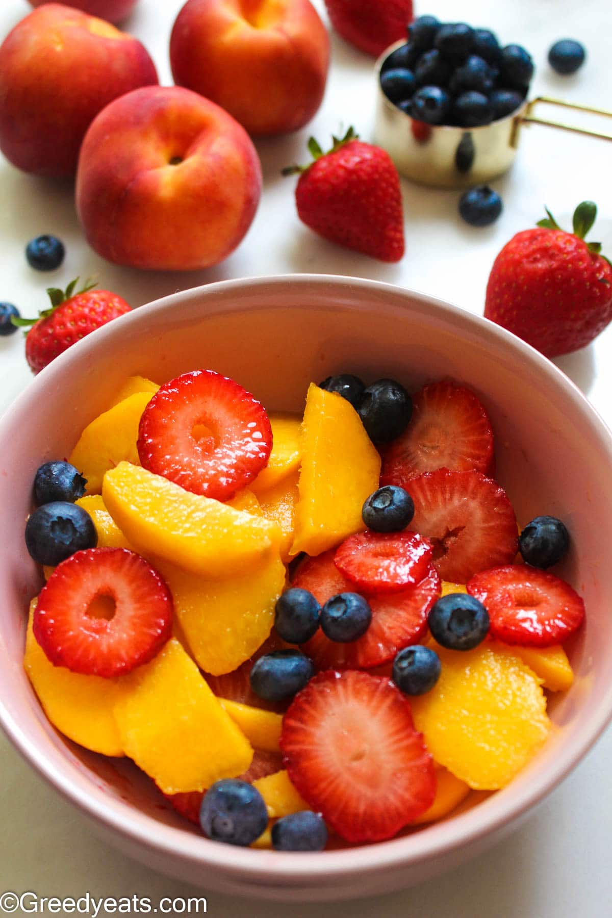 Freshly cut fruits like peach and berries for galette dough filling. 