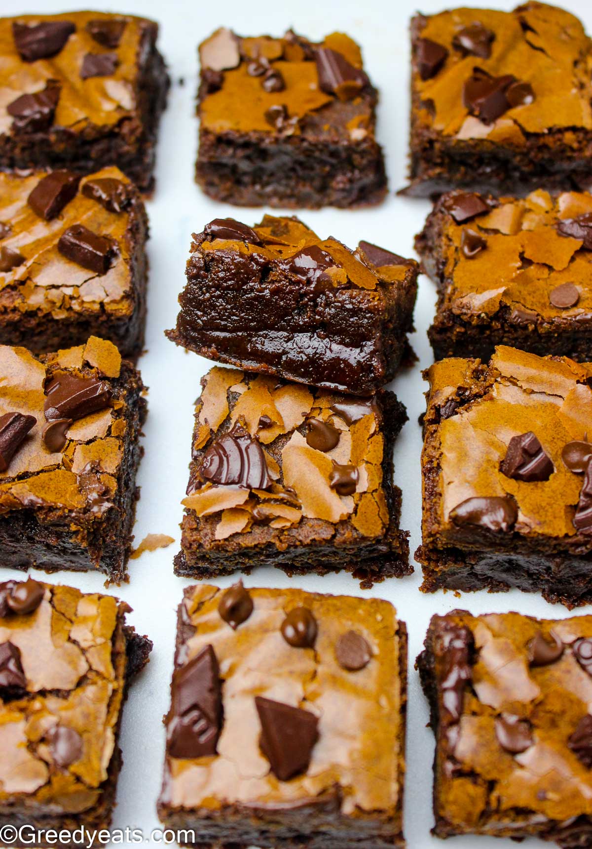 Super chewy and thick brownies that have crinkly tops and gooey edges.