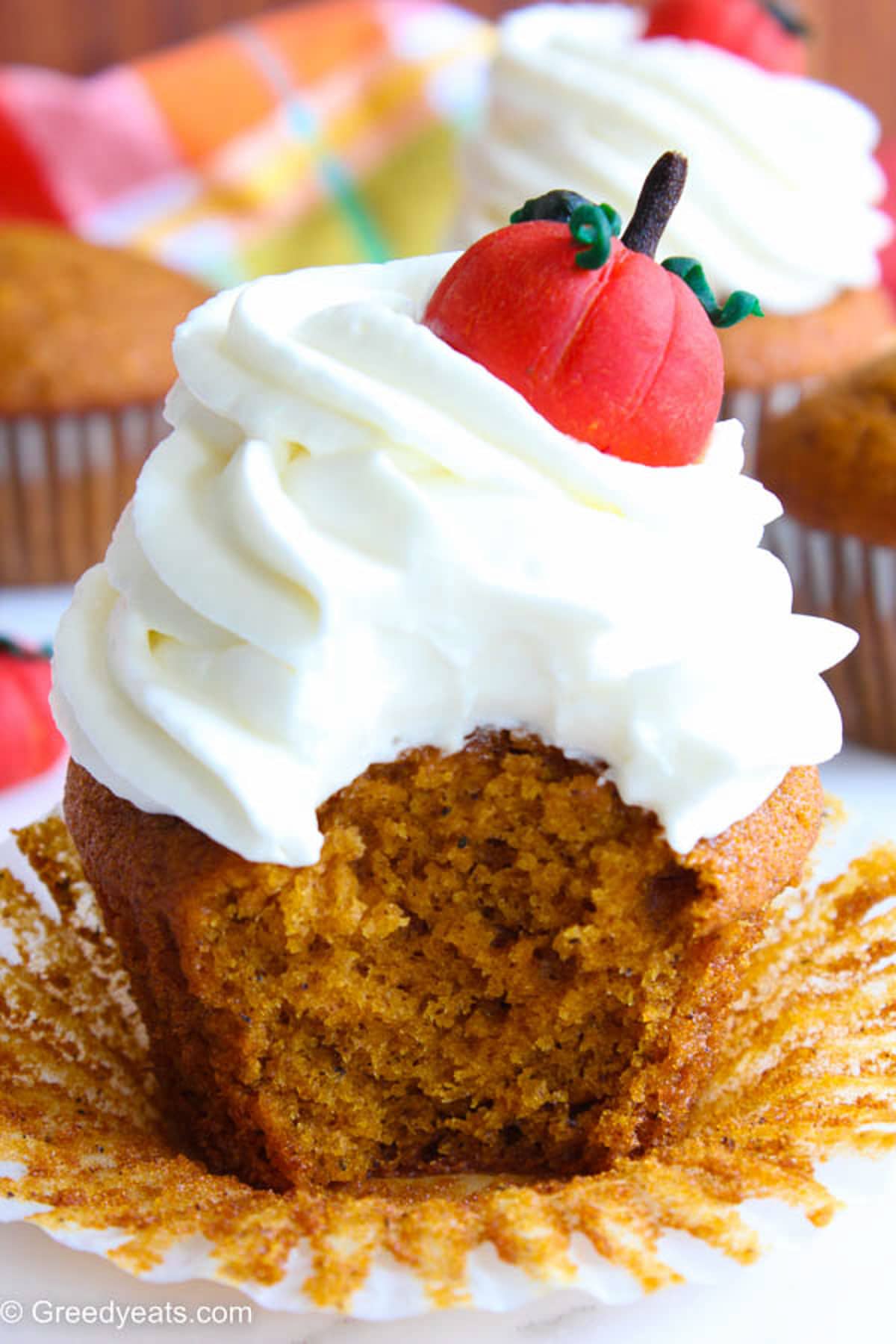 Soft, moist and Easy pumpkin cupcakes with silky cream cheese frosting and pumpkin topper.