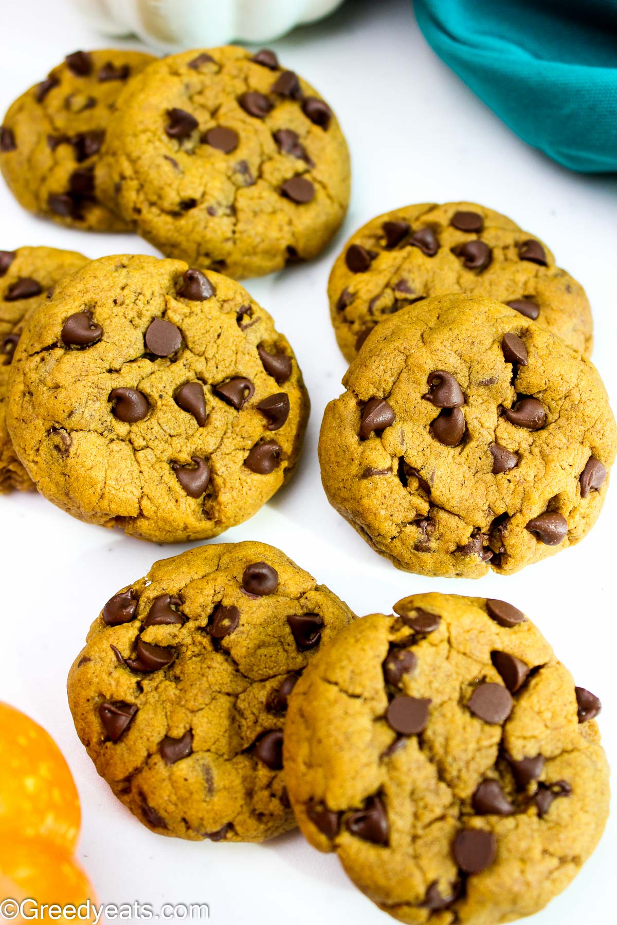 Easy and the best pumpkin cookies with melty chocolate chips kept on a white board.