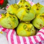 Soft and buttery Pistachio Cookies topped with sweet lemon glaze and finished off with pistachio chunks.