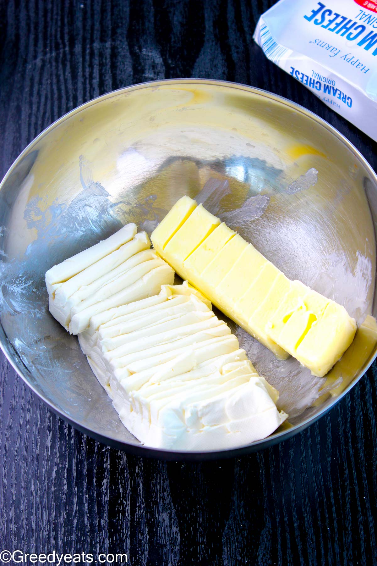 Cream cheese and butter softened to room temperature kept in a mixing bowl.