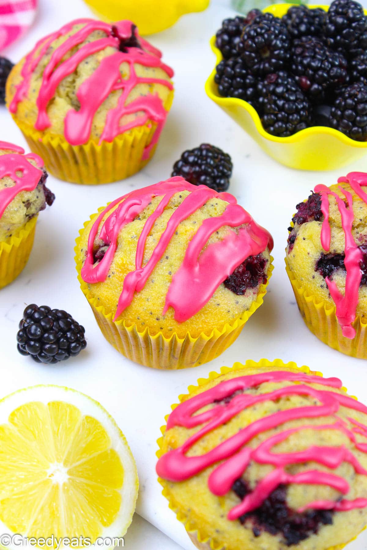 Soft and fluffy Blackberry glazed Lemon poppyseed muffins dotted with fresh blackberries.
