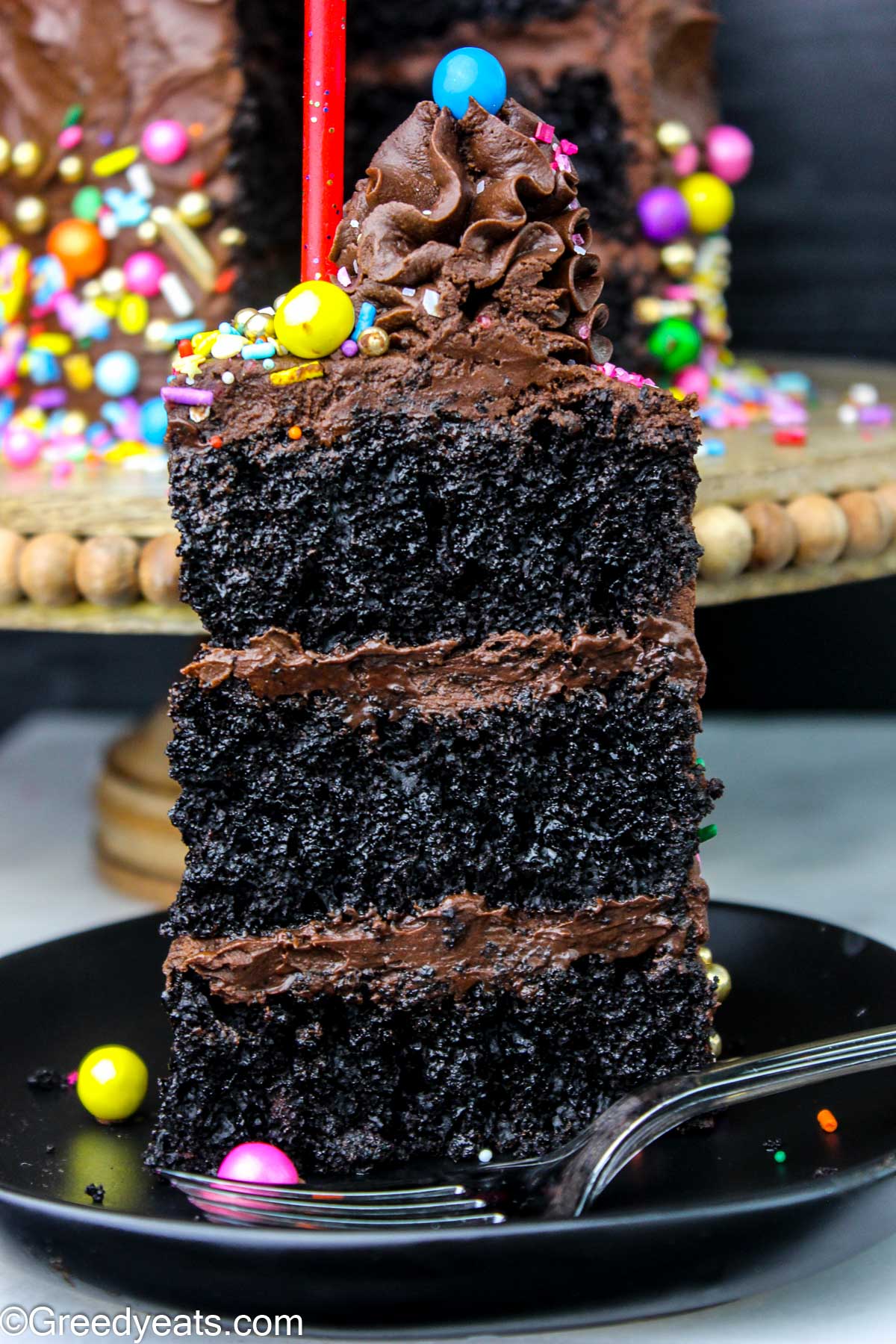 Decadent yet light, soft and Easy Chocolate Cake Recipe topped with rich chocolate frosting.