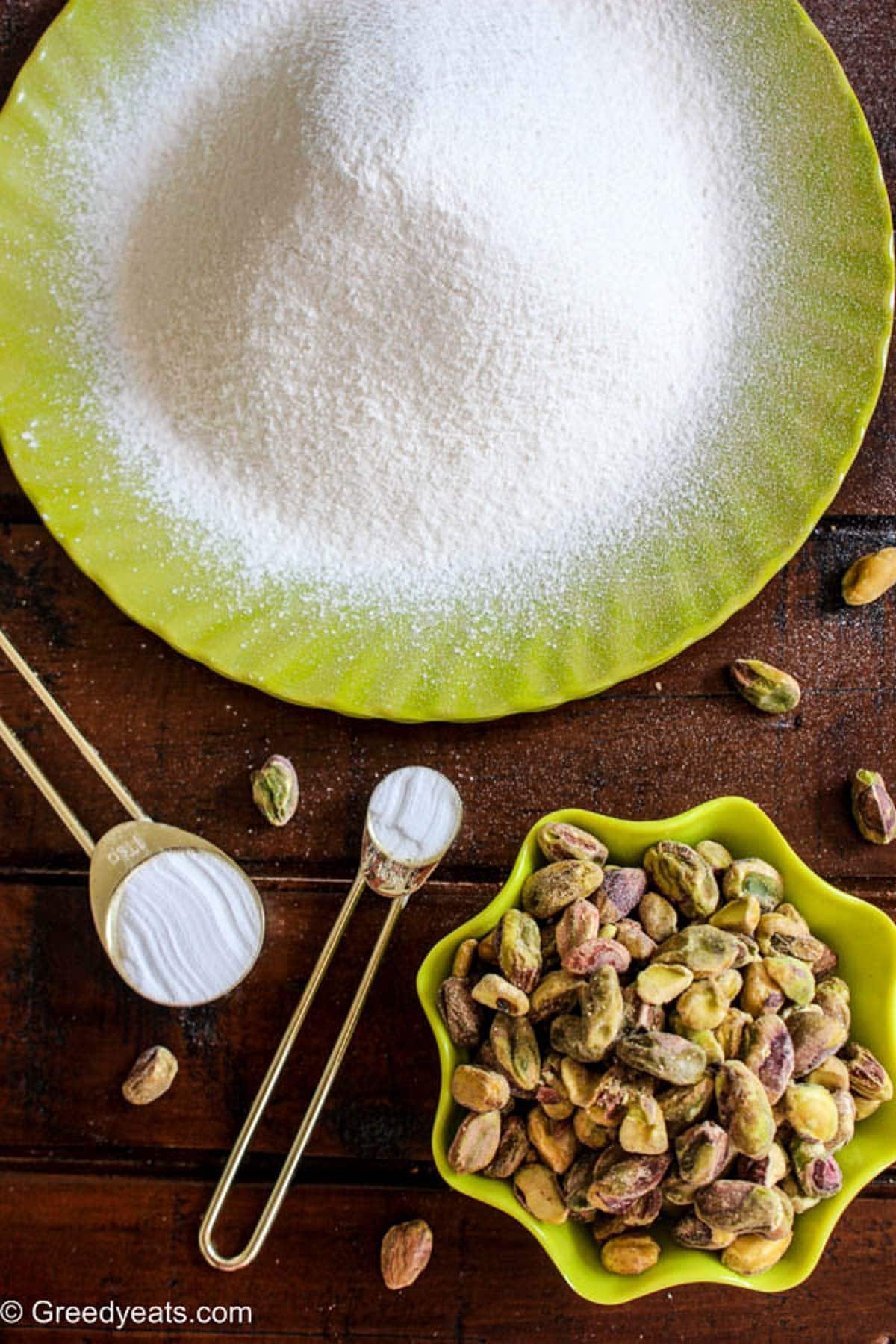 Ingredients like cake flour, leaveners and pistachios required to make cake batter.