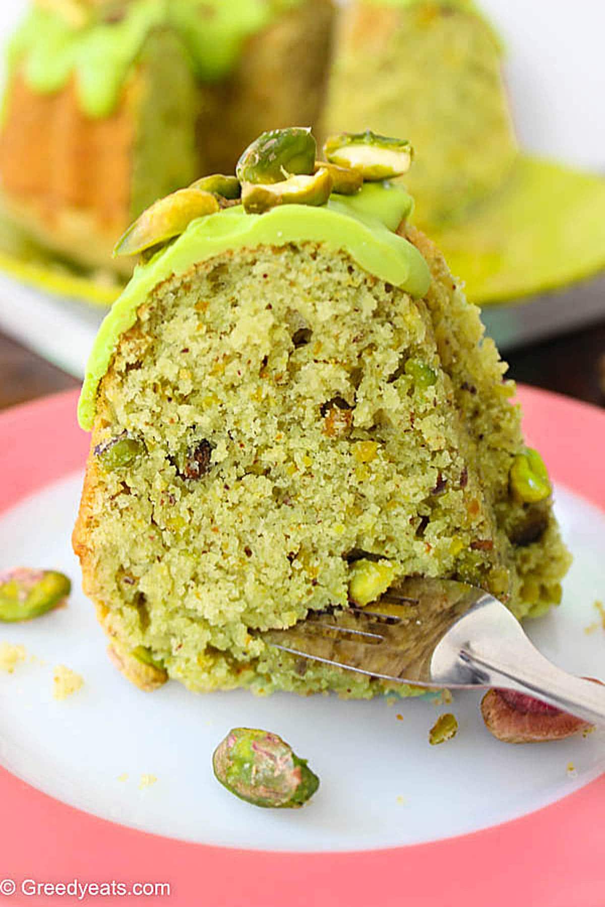 Soft and fluffy Pistachio Cake made with real pistachio flavors nd topped with chocolate topping.