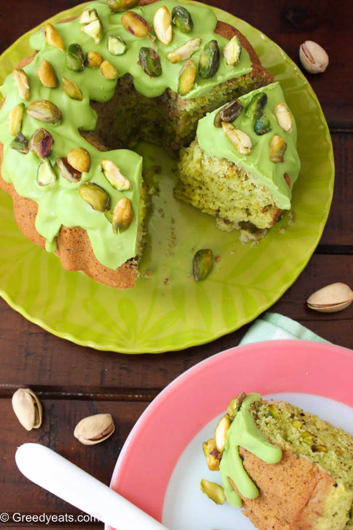 Made without pistachio pudding, this pistachio cake is topped with melted chocolate topping.