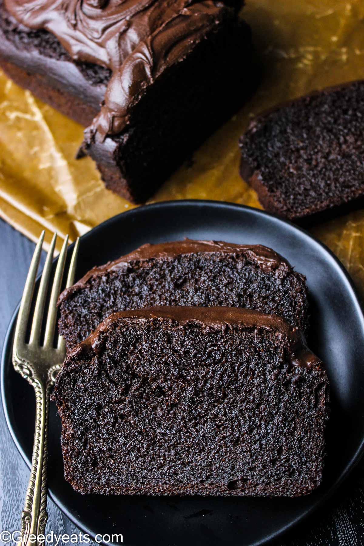 Riich and decadent Chocolate Banana Bread slices topped with silky chocolate frosting.