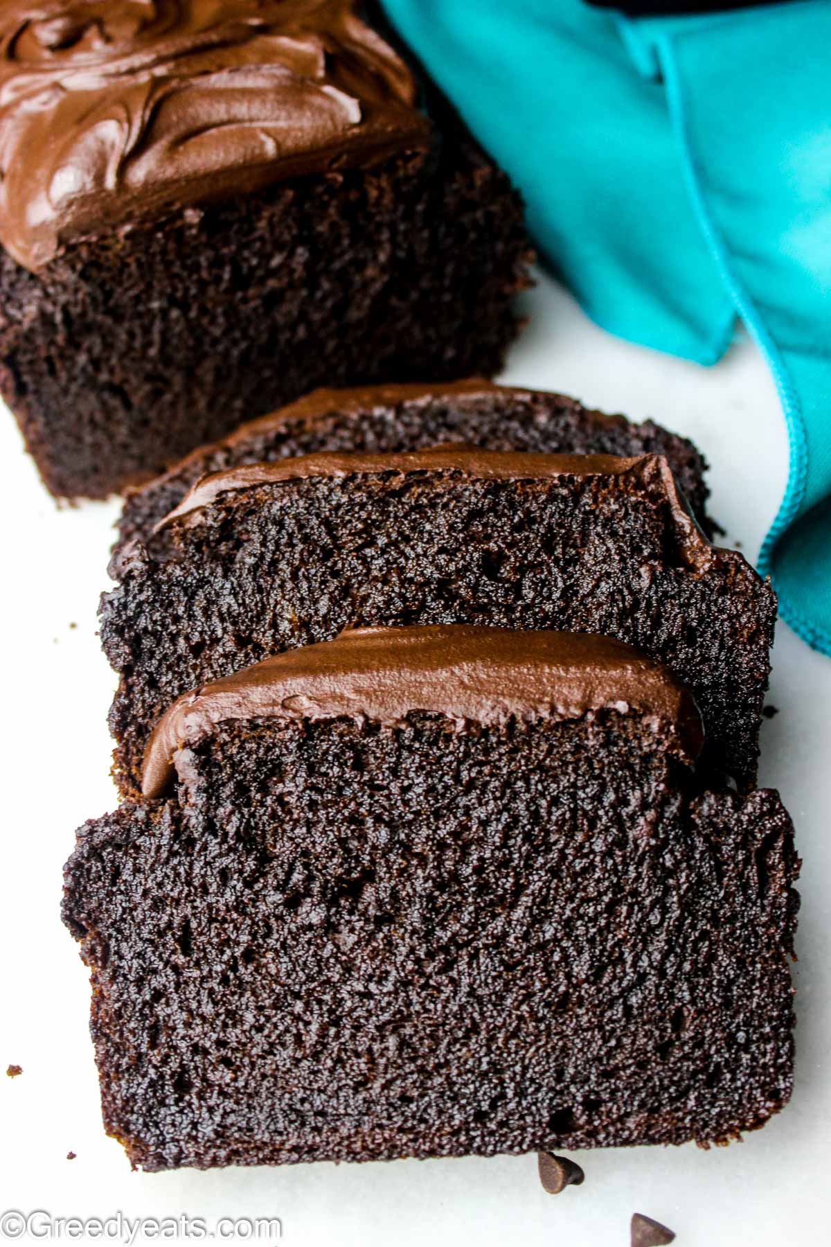 Moist and decadent Chocolate Banana Bread topped with one minute chocolate frosting.