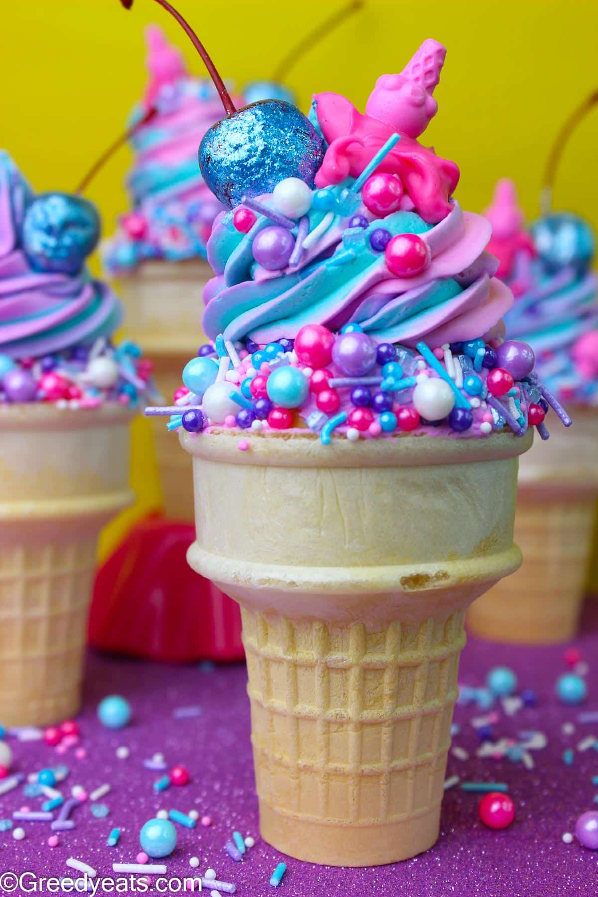 Cone cupcakes frosted with vanilla flavored buttercream frosting and topped with sprinkles.