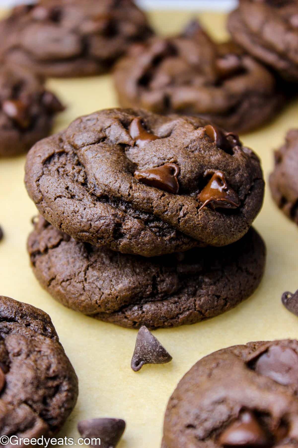 Thick and Chewy Double Chocolate cream cheese cookies kept on parchment paper.