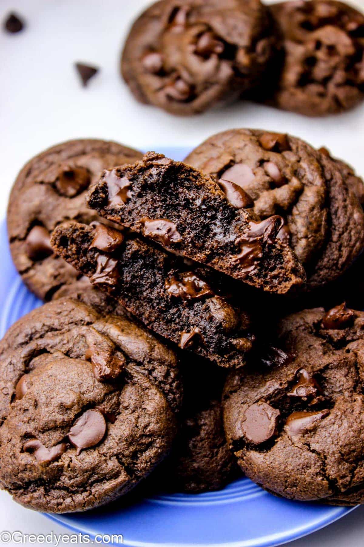 Double chocolate cookies with thick and super soft centers on a blue plate.