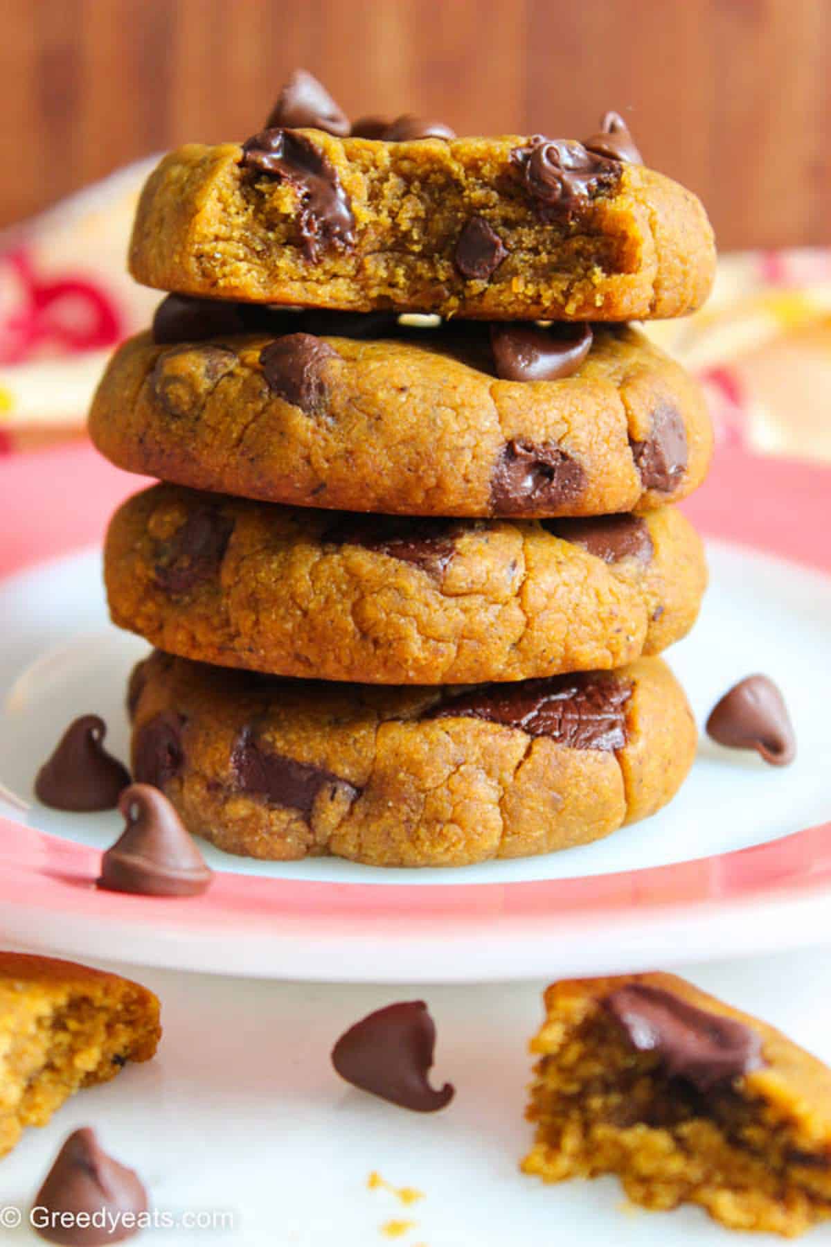 A stack of thick and chewy pumpkin chocolate chip cookies filled with delicious fall flavors.