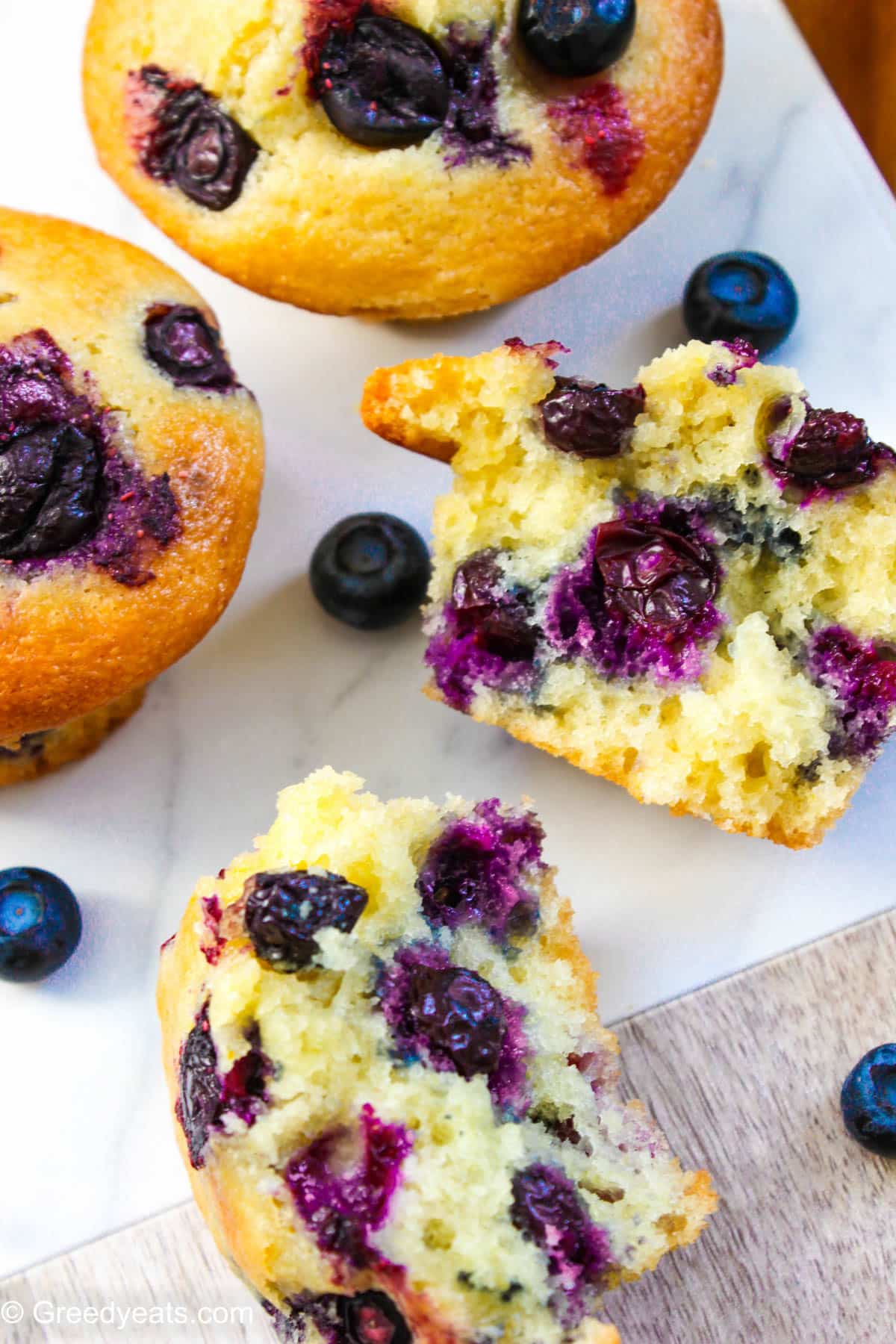 Tall, soft and moist Lemon Blueberry Muffins packed with fresh and juicy blueberries.