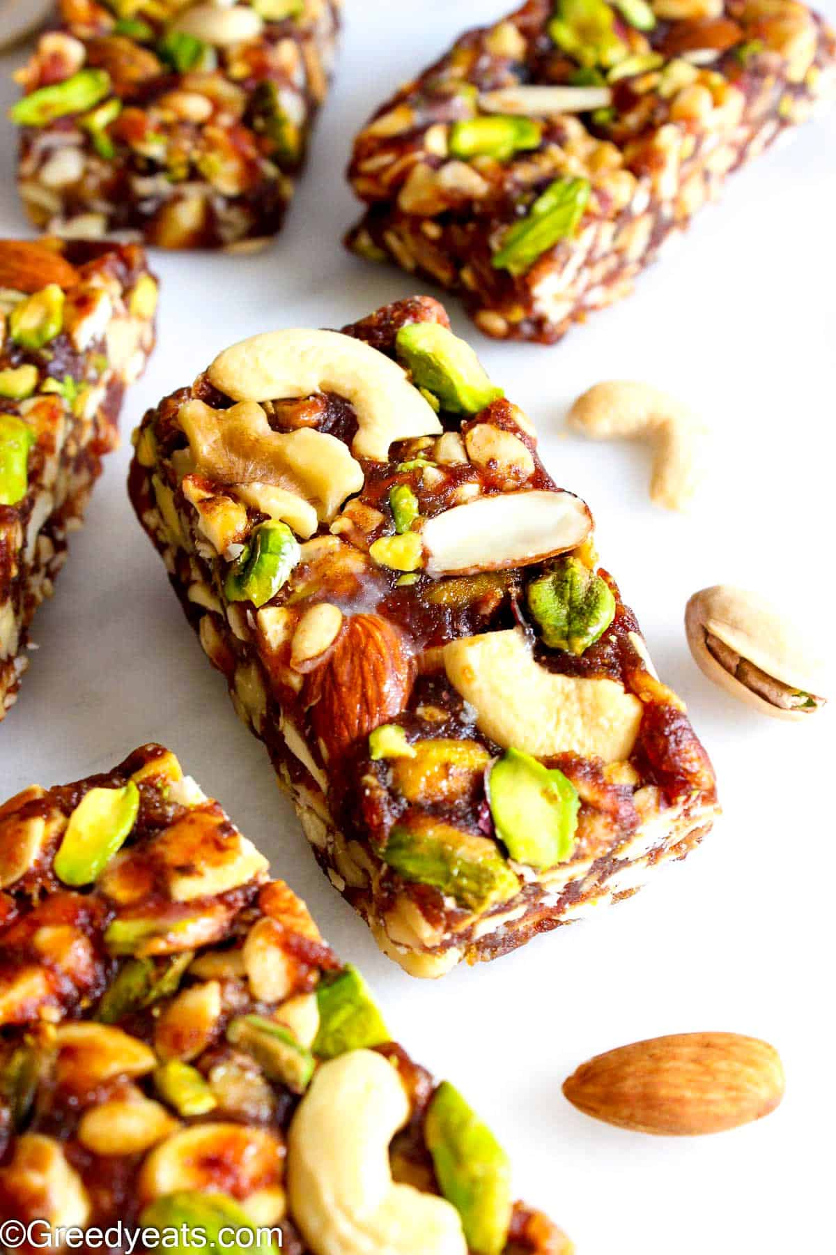 Super easy and the best Date Bars made with 3 simple ingredients topped with more nuts.