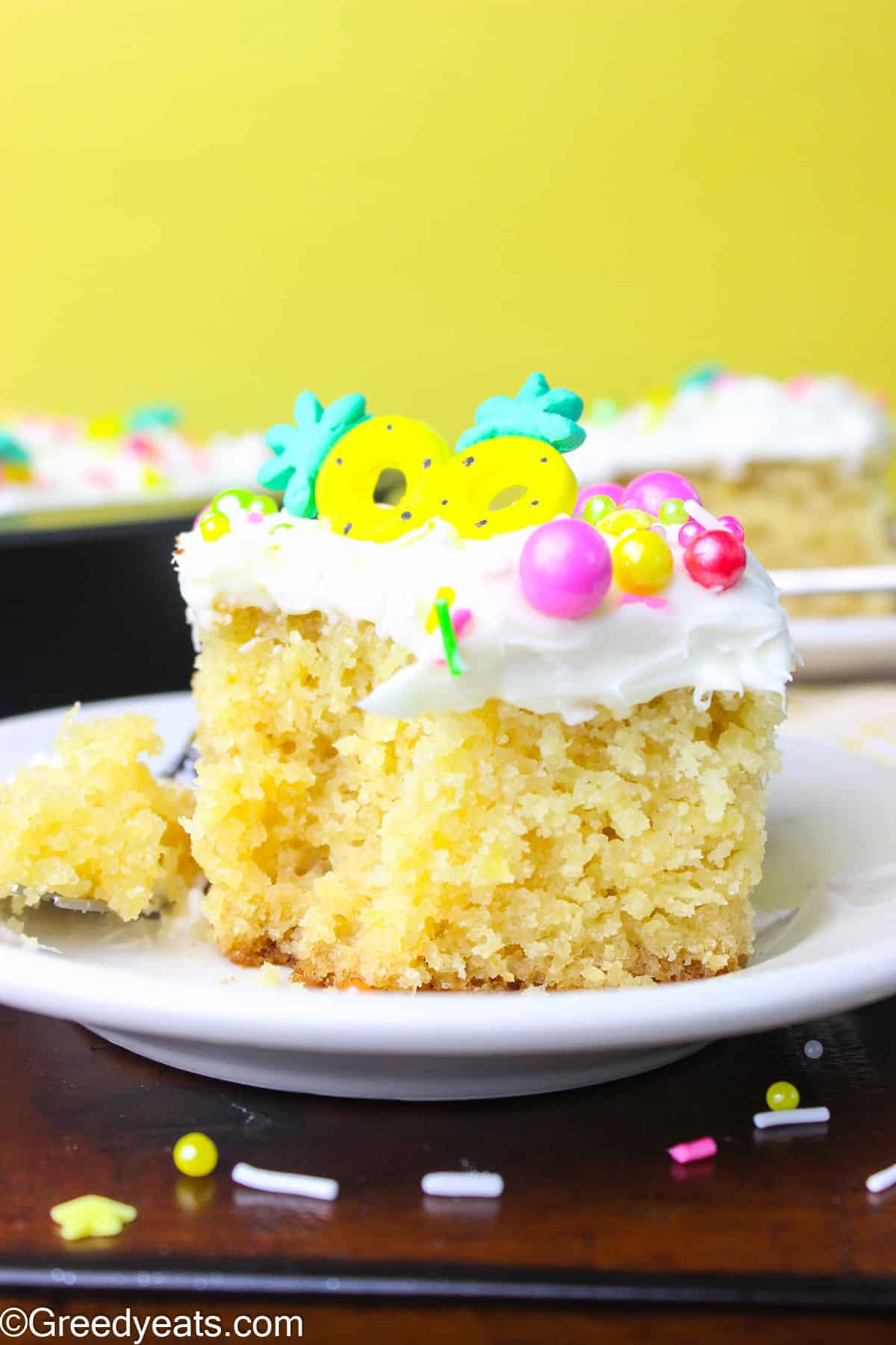 Moist and fluffy Pineapple Cake Recipe topped with sweet and tangy Cream Cheese Frosting.