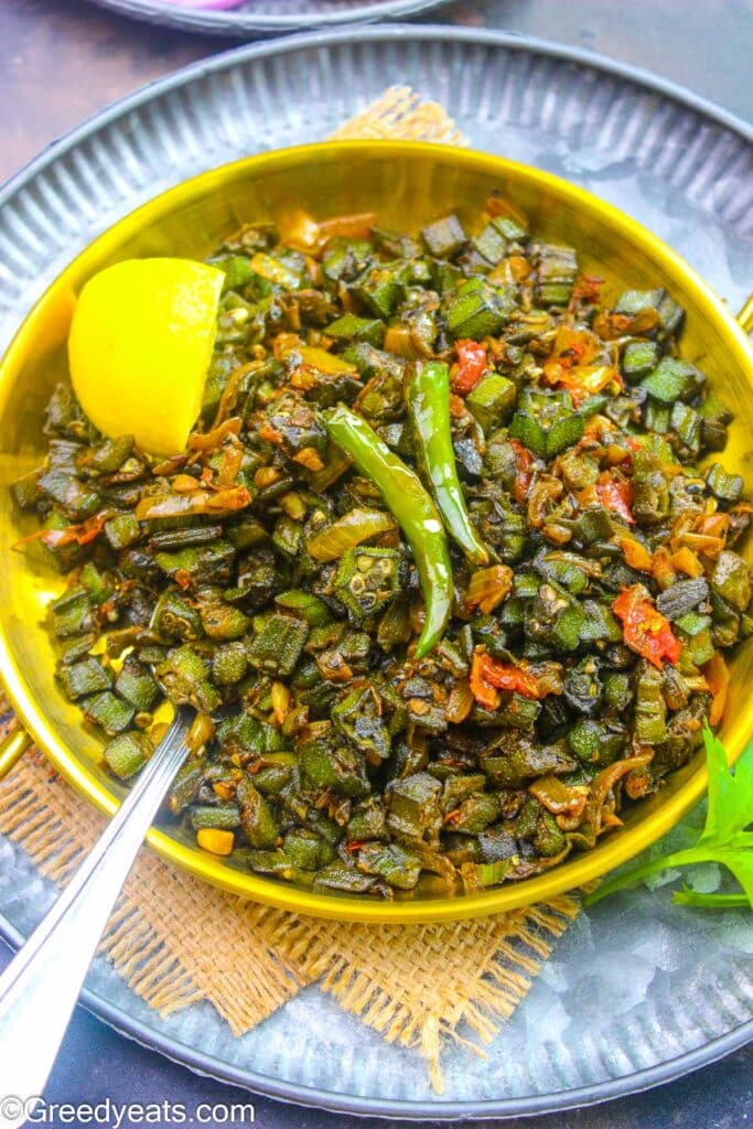 Bhindi Masala Prepared with pre-cooked bhindi in oil and then added to onion-tomato based masala.