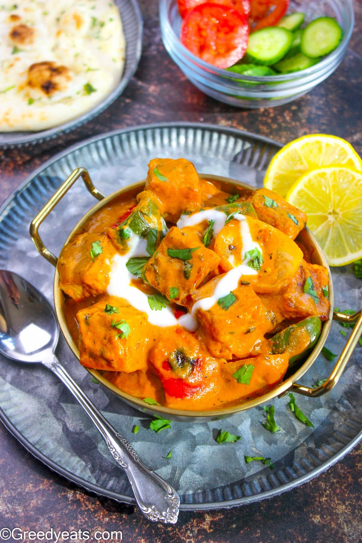 Paneer Tikka Masala made in onion tomato curry sauce with grilled vegetables and paneer tikka.