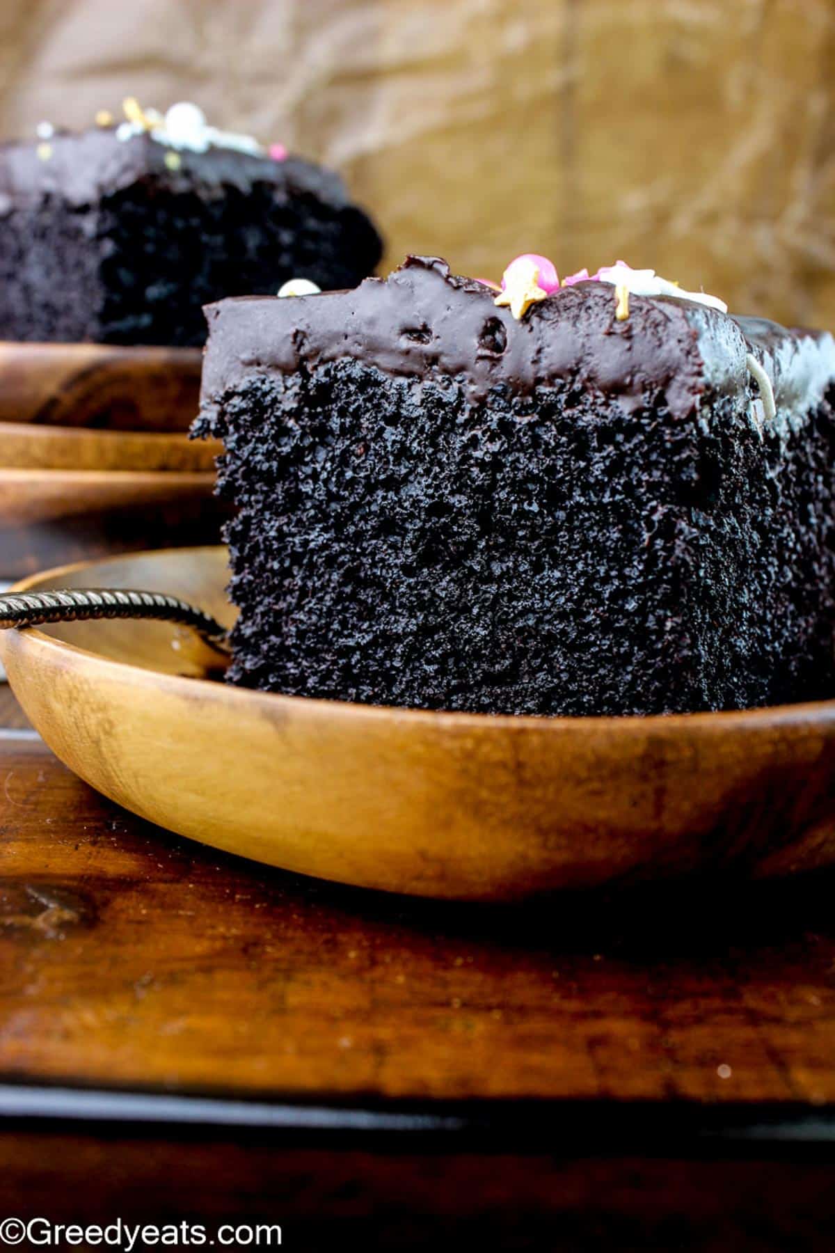 A simple Chocolate Cake Recipe baked in one bowl, topped with chocolate ganache.