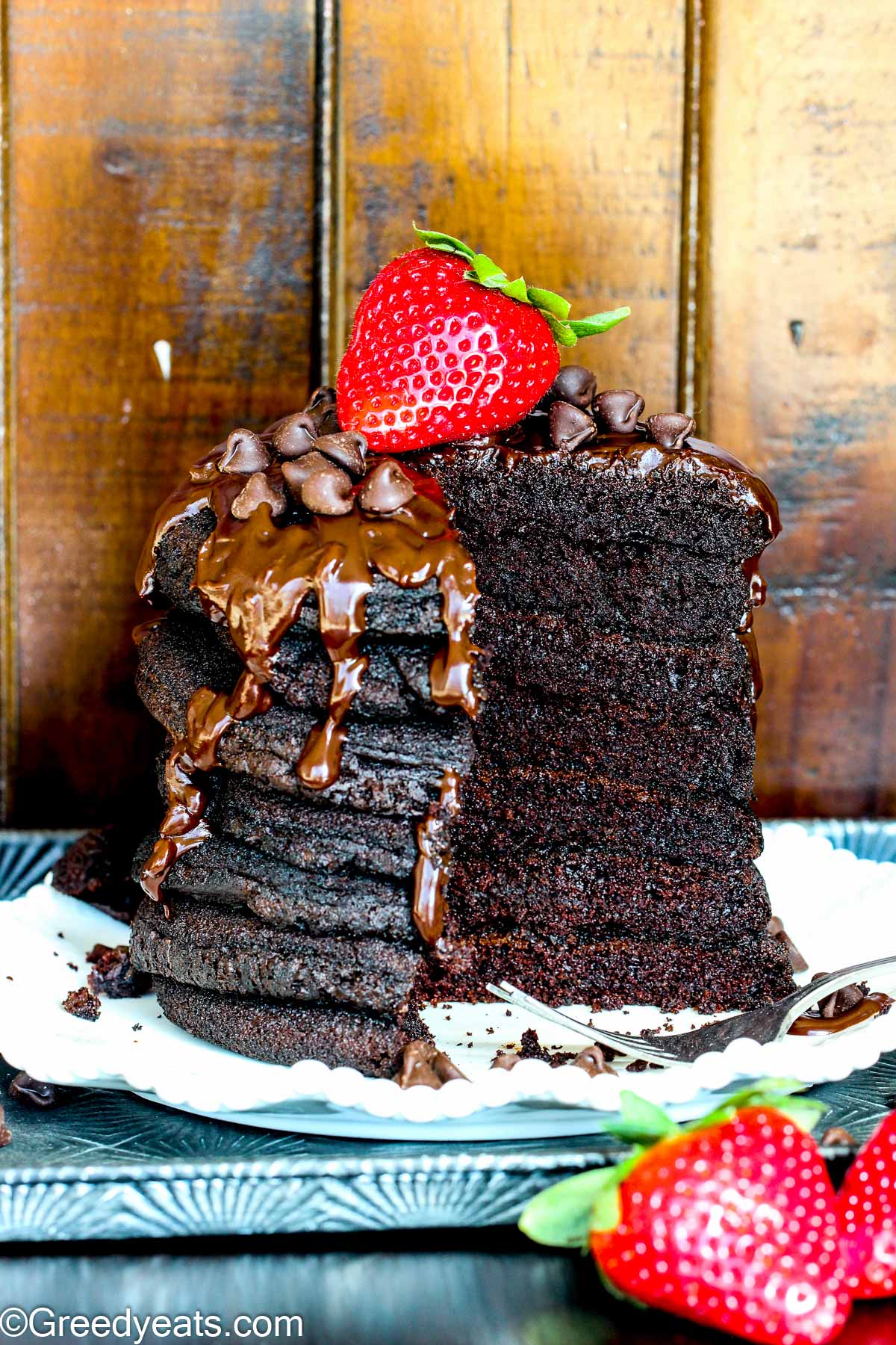 Chocolate Pancakes that cook tall and fluffy, topped with chocolate ganache.
