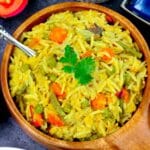 Khichdi recipe made with moong dal, toor dal, rice, vegetables and some fragrant spices.