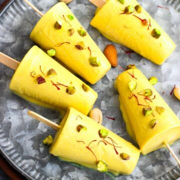 Easy Kulfi ice cream made with 3 kinds of milk, nuts, cardamom and saffron.