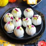 Burfi Dessert Balls made with saffron burfi and coated in white chocolate.