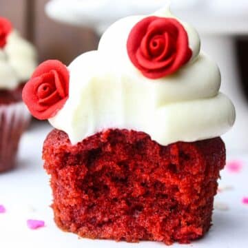 Soft and moist Red Velvet Cupcakes topped with cream cheese frosting.