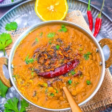 Easy Dal Fry Recipe made with toor dal, a little moong dal, aromatics and spices served with lemon and coriander.