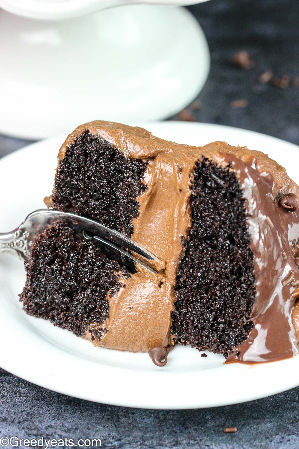 Small Chocolate Cake recipe frosting with chocolate buttercream and topped with chocolate ganache.