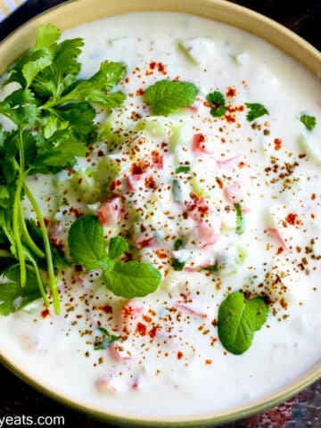 Easy raita recipe made with simple ingredients and served as a side to biryani.