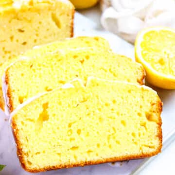 Lemon Olive Oil Cake made with greek yogurt, with ample of lemon flavor and topped with a sweet lemon glaze.