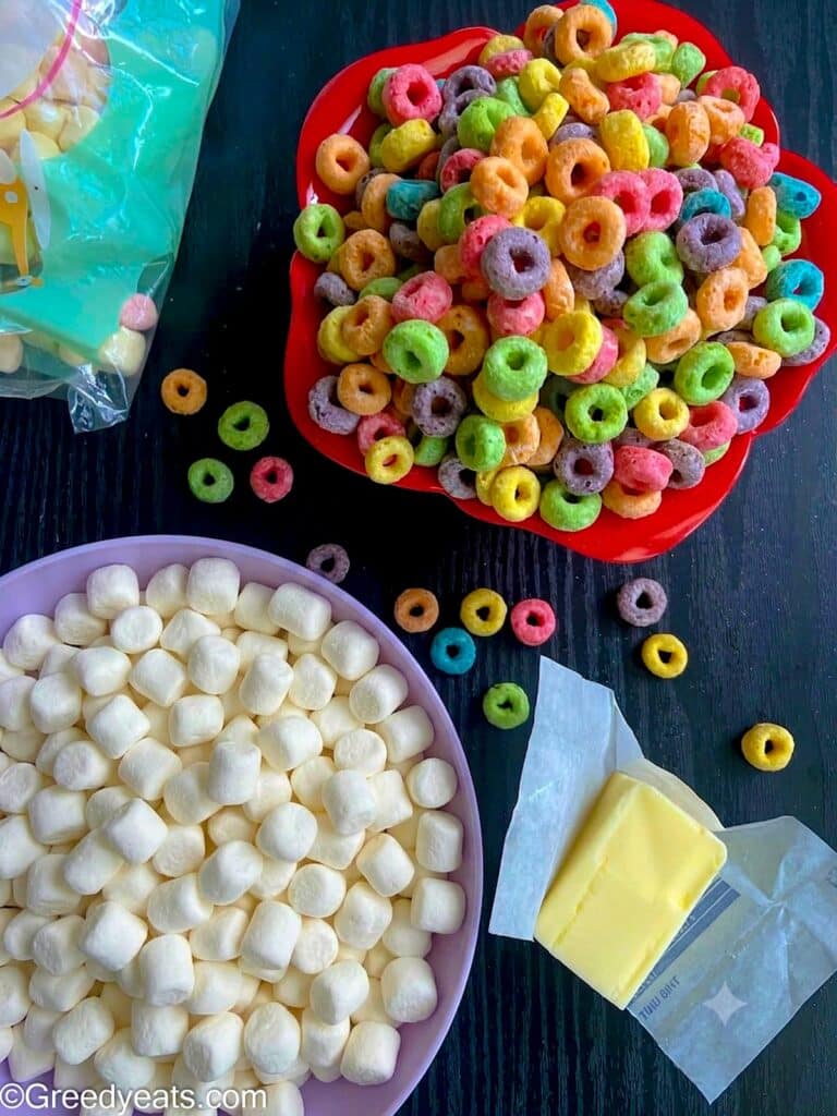 Three ingredients like butter, marshmallows and froot loop cereal needed to make cereal bars.