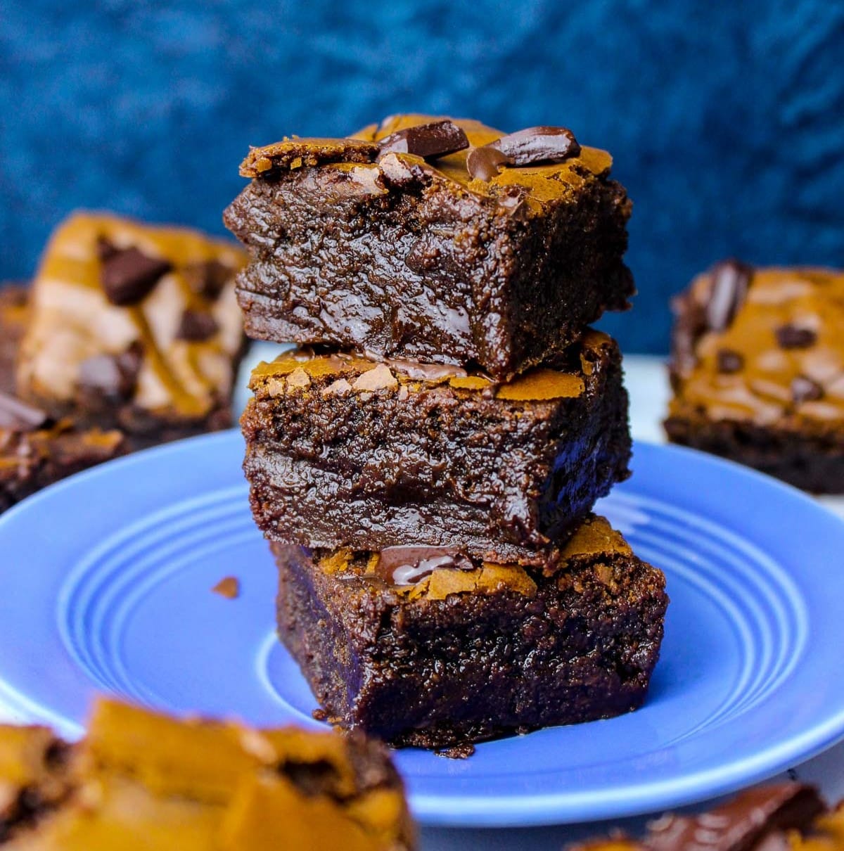 Easy brownies recipe with gooey interiors, crinkly tops and melty chocolate chips.