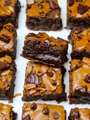 Super chewy, thick and easy homemade brownies with crinkly tops and gooey edges.