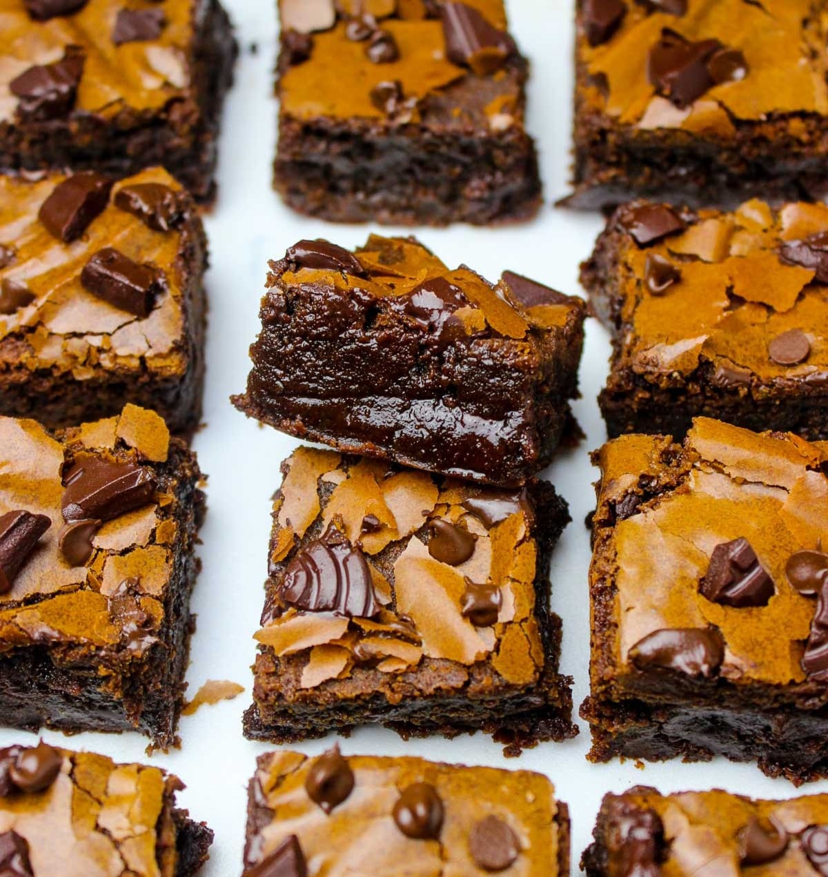 Super chewy, thick and easy homemade brownies with crinkly tops and gooey edges.