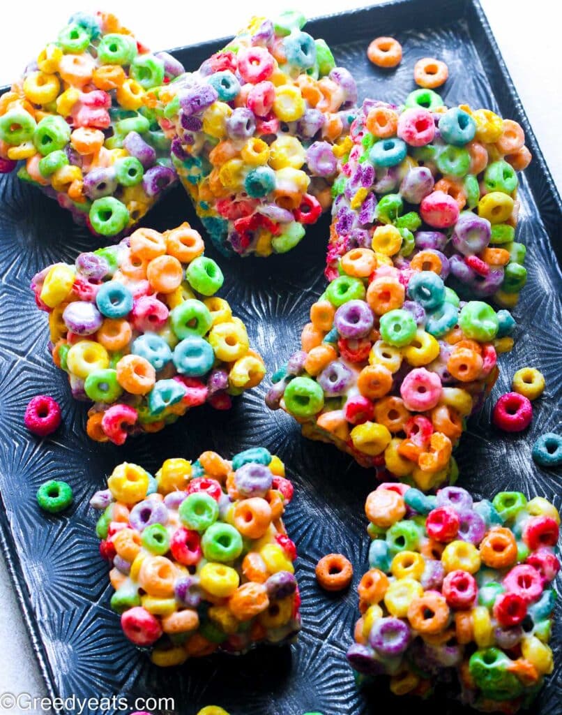Easy 3 ingredients Froot Loop Bars made with marshmallows, butter and froot loops served as squares.