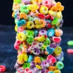 A stack of Froot Loops Bars made with three simple ingredients- butter, melted marshmallows and cereal.