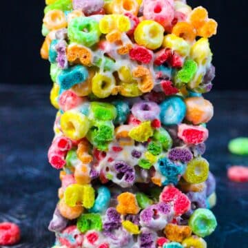 A stack of Froot Loops Bars made with three simple ingredients- butter, melted marshmallows and cereal.