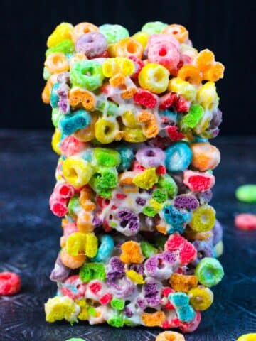 A stack of Froot Loops Bars made with three simple ingredients- butter, melted marshmallows and cereal.