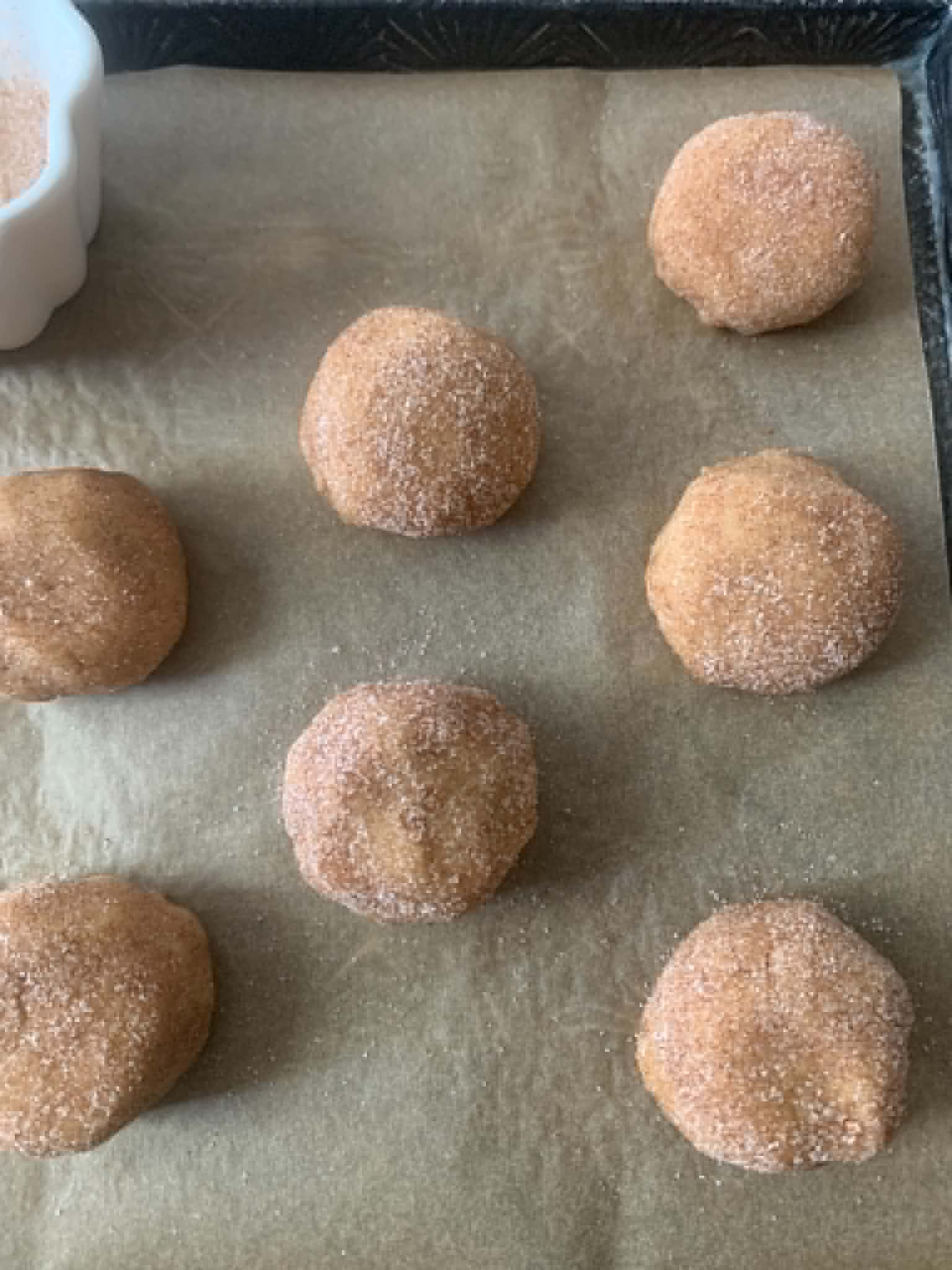 Banana Cookie Dough Balls lined with a parchment paper.