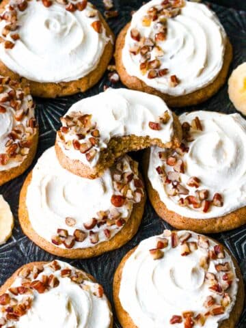 Chewy, soft and flavorful Banana Cookies topped with cream cheese frosting.