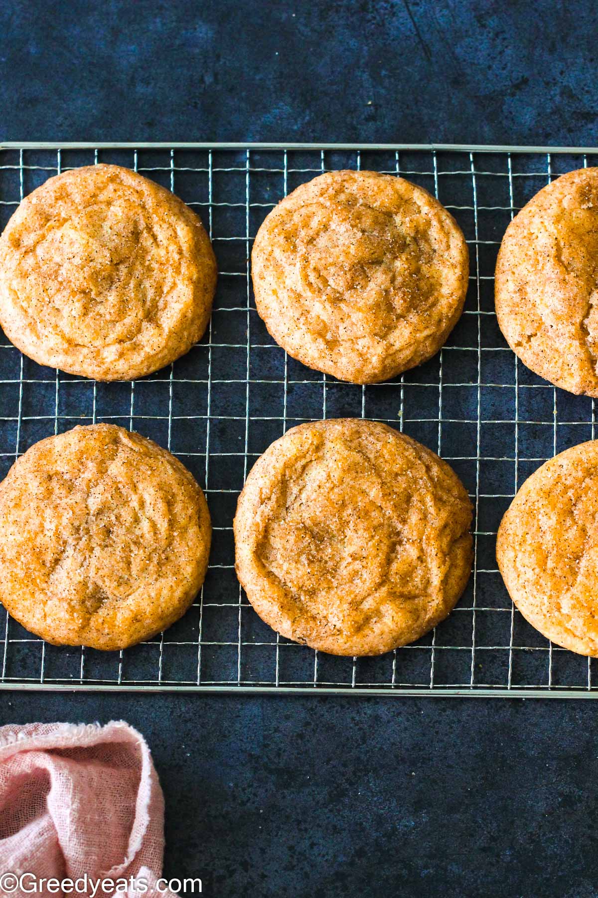 Baked banana bread cookies with a roll of cinnamon sugar.
