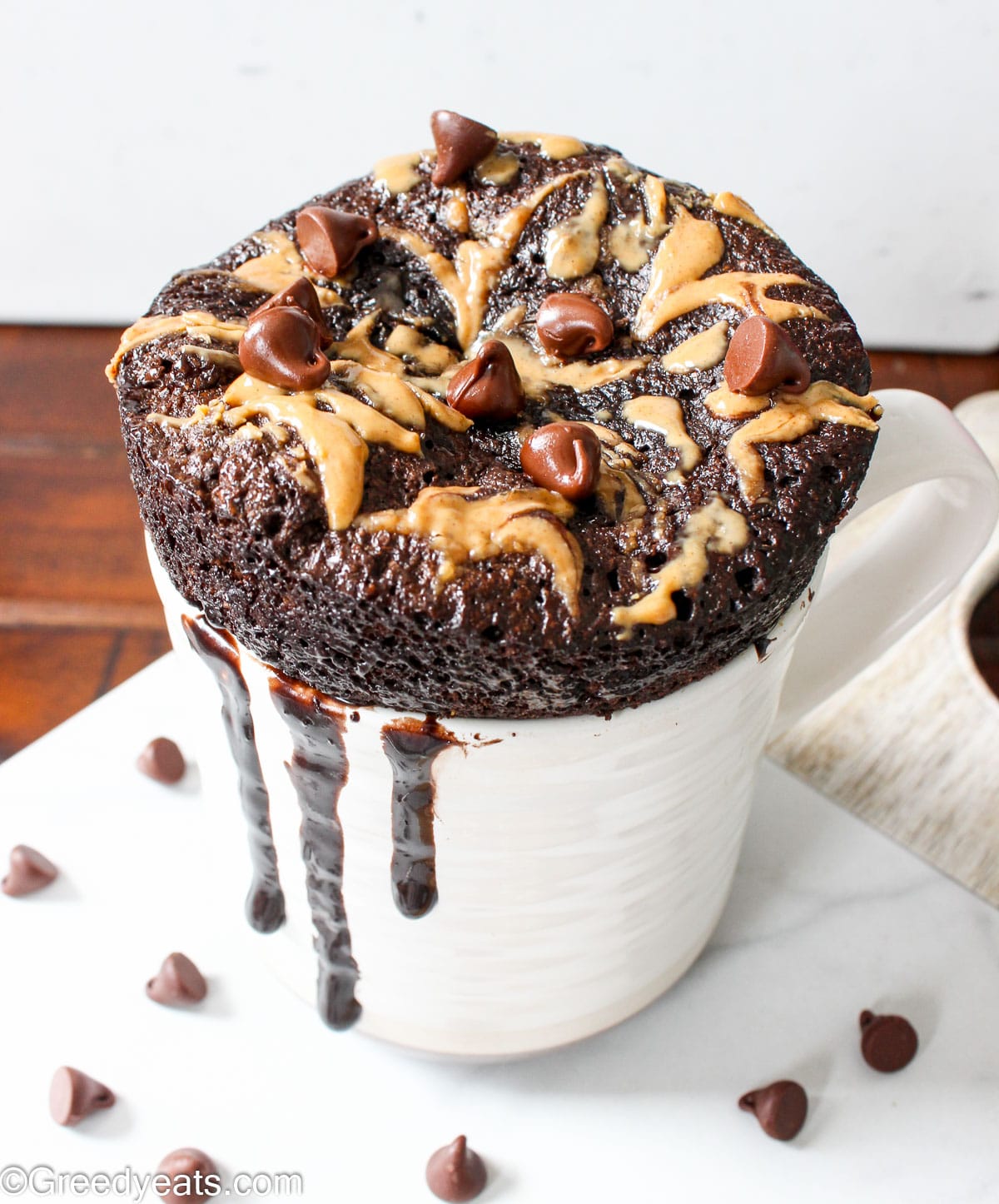 Soft and fluffy Peanut Butter Mug Cake made in microwave in under 5 minutes topped with more peanut butter.
