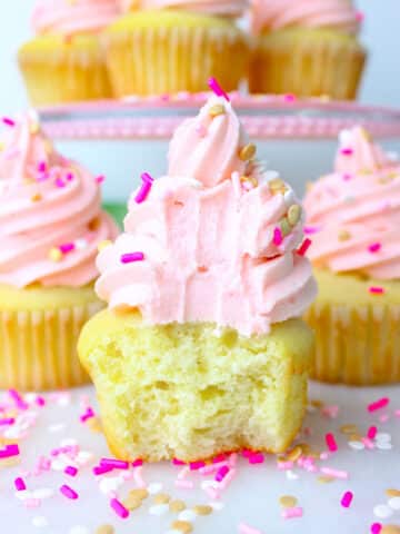 Soft, fluffy and moist Vanilla Cupcakes Recipe topped with a silky vanilla buttercream and sprinkles.