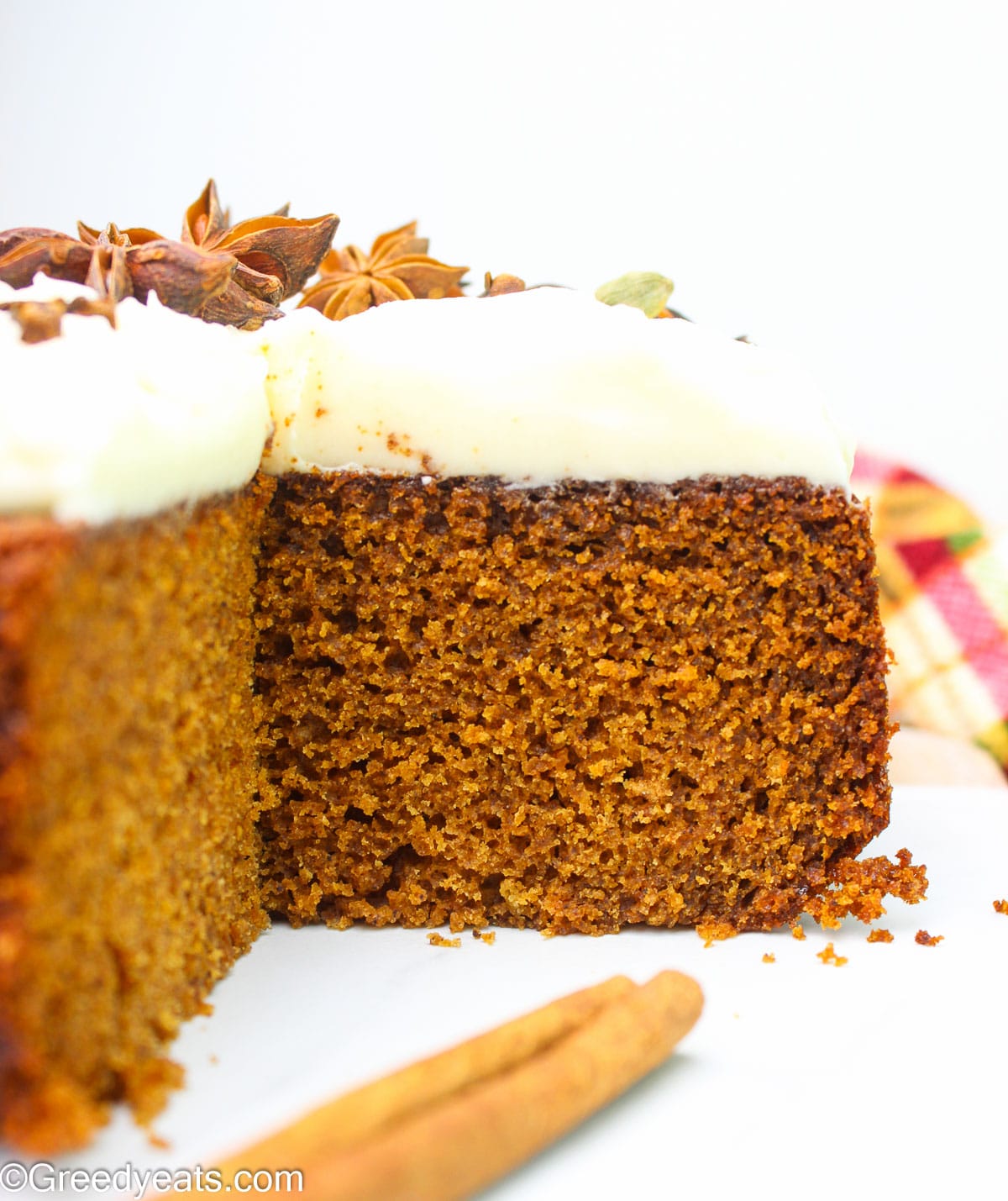 Super moist Spice Cake Recipe topped with a luscious cream cheese frosting.